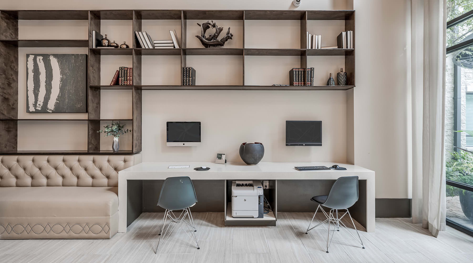 The Lifestyle You Deserve computer workstations near large window in clubhouse
