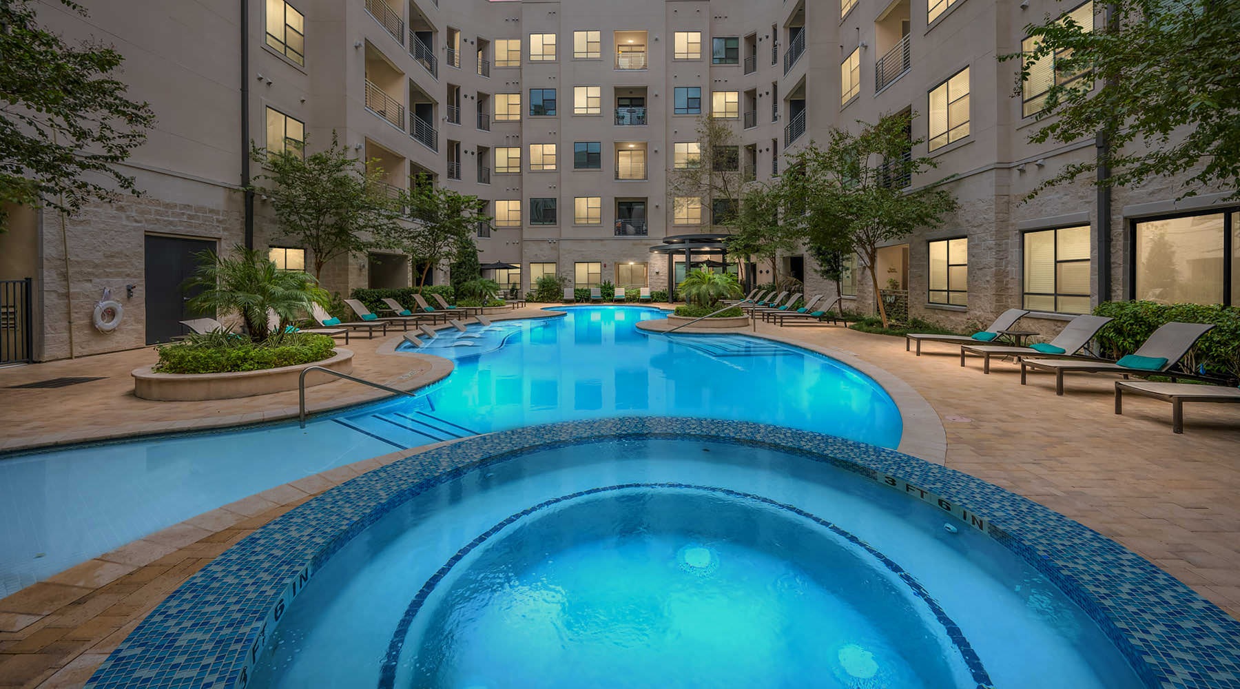 pool and spa lit at night