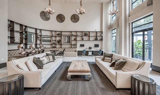 couches in large clubroom with large windows